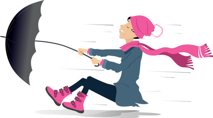 Young woman, umbrella and windy day. 
Young female person in warm clothes with umbrella stands on the strong wind. Isolated on white background
