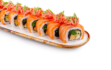 Delicious sushi rolls with fresh salmon and toppings on a white plate