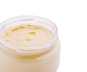 Natural creamy spread or mayonnaise in glass jar for delicious recipes and snacks