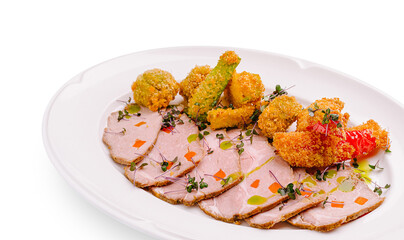 Savory platter featuring sliced roast meat and crispy vegetables on white plate