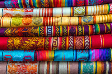 Pile of traditional andean textiles, Otavalo Market, Ecuador.