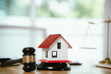 A gavel symbolizes law, justice, and authority in business and real estate auctions, representing contracts, ownership, finance, property sales, and legal agreements.