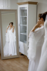 Naklejka premium Elegance and preparation of a bride in a beautiful bridal gown before the ceremony