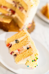 Single slice of layered vanilla cake