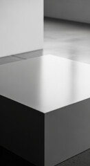White square pedestal on gray floor, minimalist design, showcasing blank space for product display or advertisement, ideal for clean and modern branding