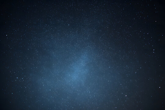 A blue, watercolor-style space background. Illustration