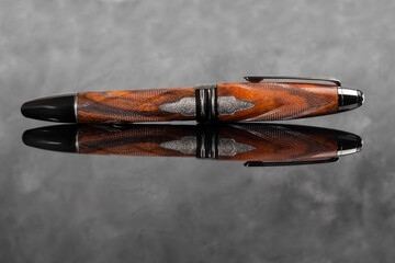 Fountain pen on dark marble background. Rare writing instruments.