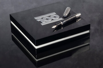 Fountain pen on dark marble background. Rare writing instruments.