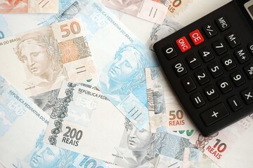 Brazilian reais banknotes and calculator. The current Brazil real money bills and calculator