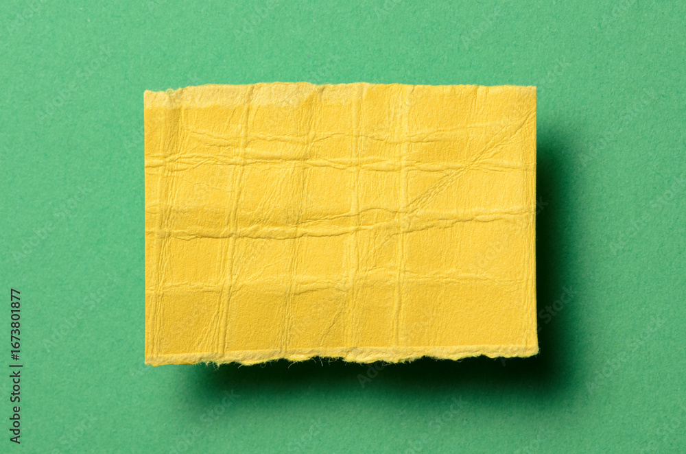Poster one single yellow torn ripped wrinkled crumpled blank paper note with shadow and copy space for text