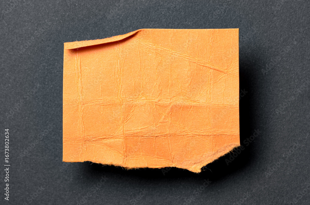 Aufkleber one single orange torn ripped wrinkled crumpled blank paper note with drop shadow, folded edge and c