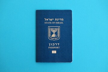 Israel passport on blue. The current Israel biometrical pass lies on blue background