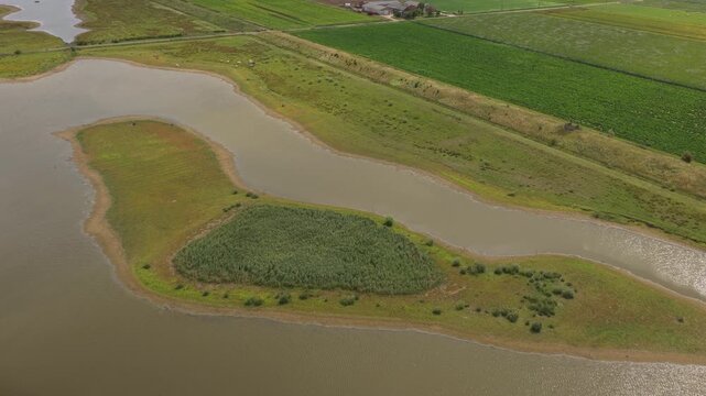 Aerial drone shot of Doel Nuclear Power Plant with steam clouds, Belgium