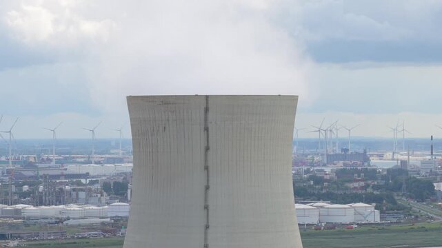 Doel Nuclear Station in Belgium, aerial of cooling towers with steam plume
