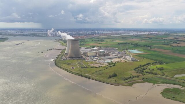 Belgium Doel Nuclear Power Plant, aerial scene with smoke from towers