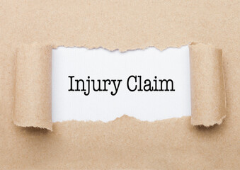 Injury Claim text appearing behind brown paper