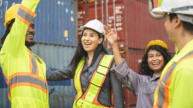 Happy Diverse Industrial Workers Celebrating Success, Team of Engineers and Foremen Working at Cargo Port, Multi-ethnic Construction Team High-Fiving on Site
