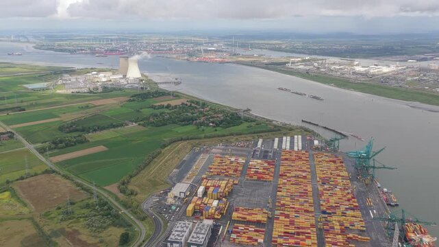 Drone aerial of Antwerp container port with Doel nuclear power station, Belgium