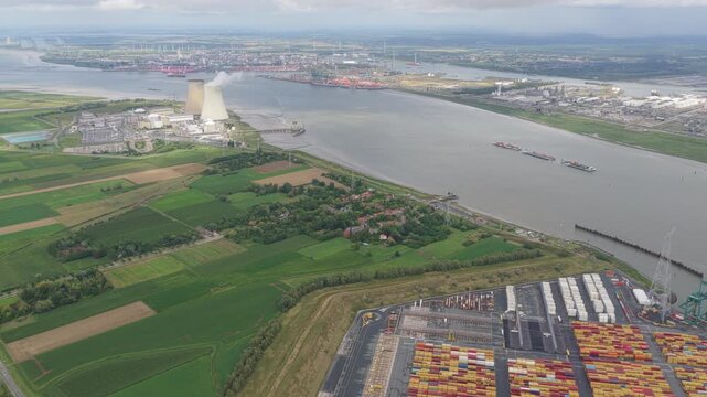 Aerial panorama of Antwerp harbor terminal beside Doel nuclear plant, Belgium