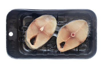 Raw king mackerel steak in a vacuum pack isolated on a transparent background. Top view shot