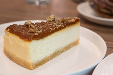 Indulge in a Delicious Slice of Creamy Cheesecake Drizzled with Rich Caramel Topping