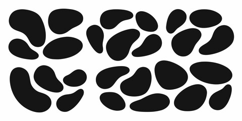 Abstract organic shapes in black on a white background forming a dynamic pattern