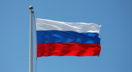 Russia National Flag Waving on Flagpole Against Clear Blue Sky &ndash; Russia Day Celebration