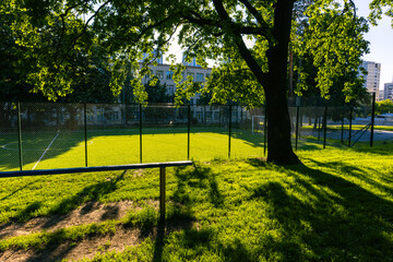 Soccer field in the park next to the school on a warm sunny day