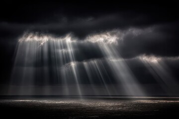 Dramatic light piercing dark clouds over a stormy sea