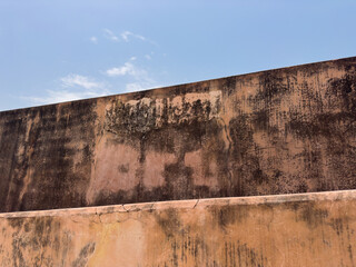 textured old walls and blue sky