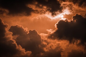 Dramatic sunset or sunrise through ominous clouds