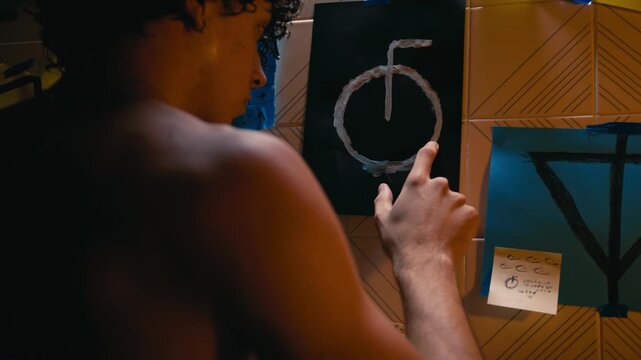 Man tries to decipher strange symbols that appeared on his wall