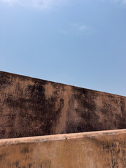 textured old walls and blue sky