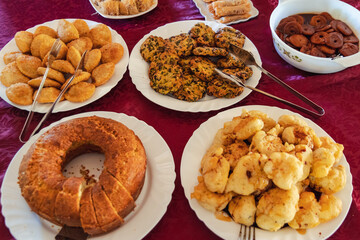 Homemade cake with Halloumi cheese, cookies with pieces of olives and dumplings in Cyprus island country