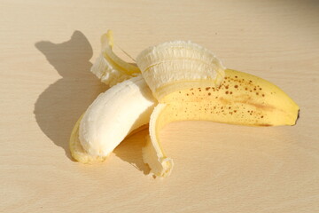 Fresh bananas on wooden table, Ripe yellow bananas, rich in potassium, healthy lifestyle, diet,...