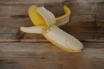 Fresh bananas on wooden table, Ripe yellow bananas, rich in potassium, healthy lifestyle, diet,...