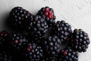 Closeup of blackberries on white background