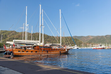 A beautiful wooden sailboat anchored in a marina of Marmaris, Turkey