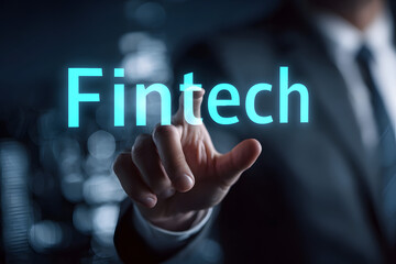 Business, Technology, Internet and network concept. oung businessman shows theword on the virtual displa of the future: Fintech