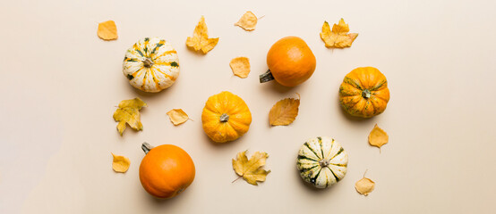 Autumn composition. Pattern made of dried leaves and other design accessories on table. Flat lay,...