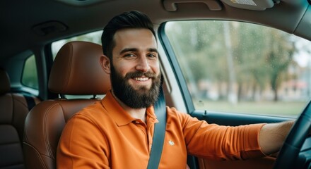 Bearded man smiling behind steering wheel with interior view