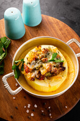 Round zucchini baked with minced meat and cheese vertical photo