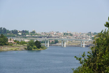 Obraz premium The view of the bridge do Freixo and river Douro in Poro, Portugal