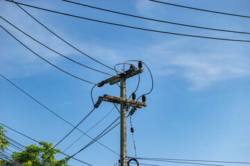 Power Line Poles Against Clear Sky