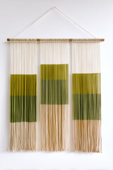 A contemporary textile art piece showcasing gradient colors and natural fibers, perfect for modern home decor.