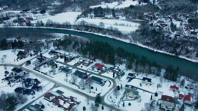 An aerial drone shot captures the serene winter landscape of Oppdal, Norway.