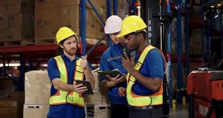 warehouse teamwork including african american worker and caucasian staff analyzing cargo management data near forklift using tablet during logistic operation in modern stock distribution environment - Powered by Adobe