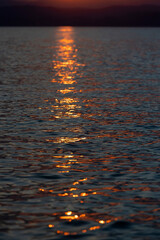 Sunset Reflections on Tranquil Waters at Dusk