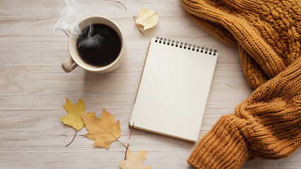blank note paper with autumn leaves and coffee