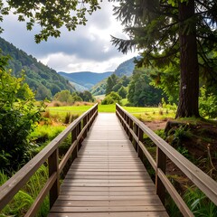 Obraz premium A serene wooden bridge stretches into a verdant valley, inviting contemplation.